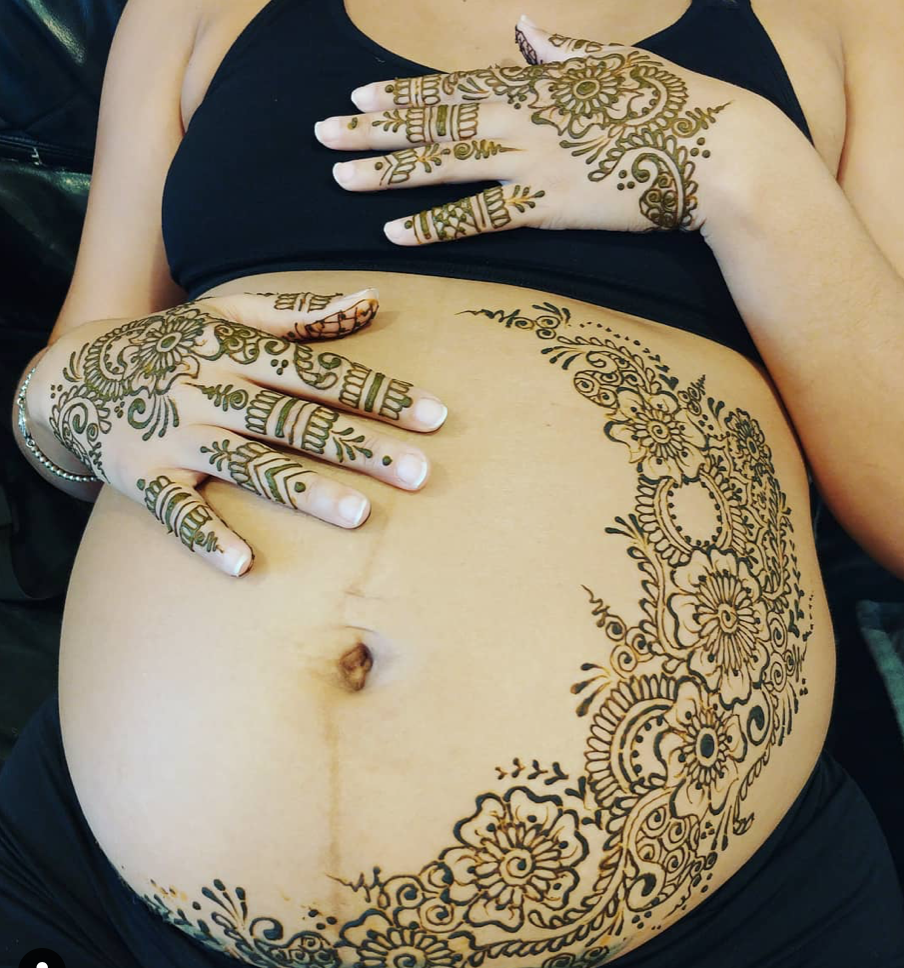 belly blessing for mom and baby with henna tattoos at baby shower event 